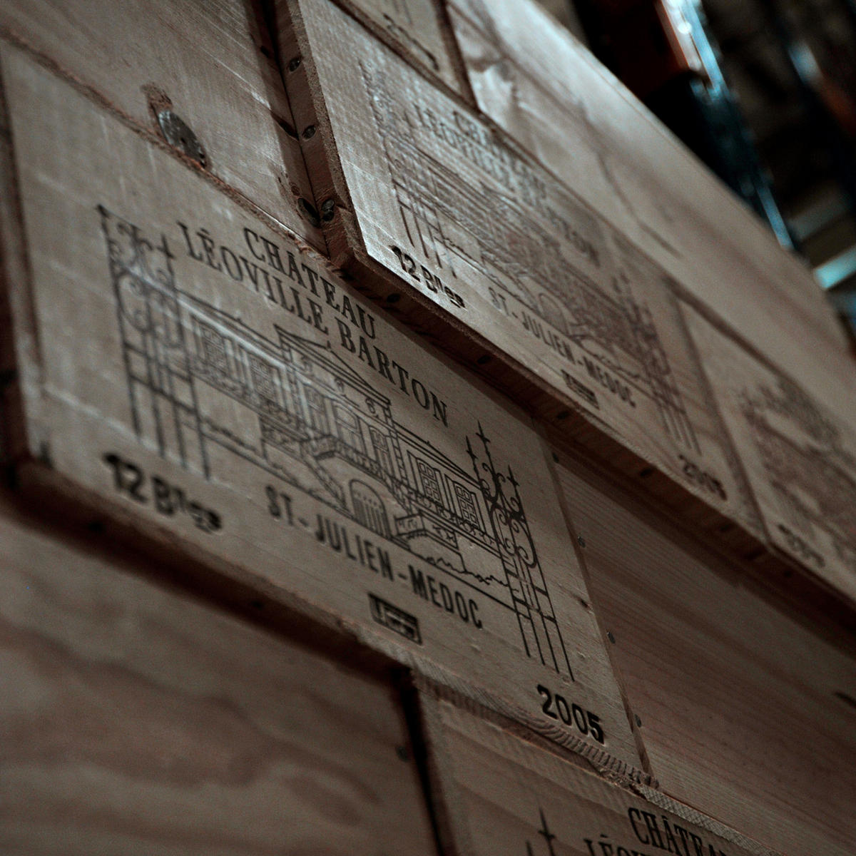 Cases of Château Léoville Barton stacked in a warehouse.