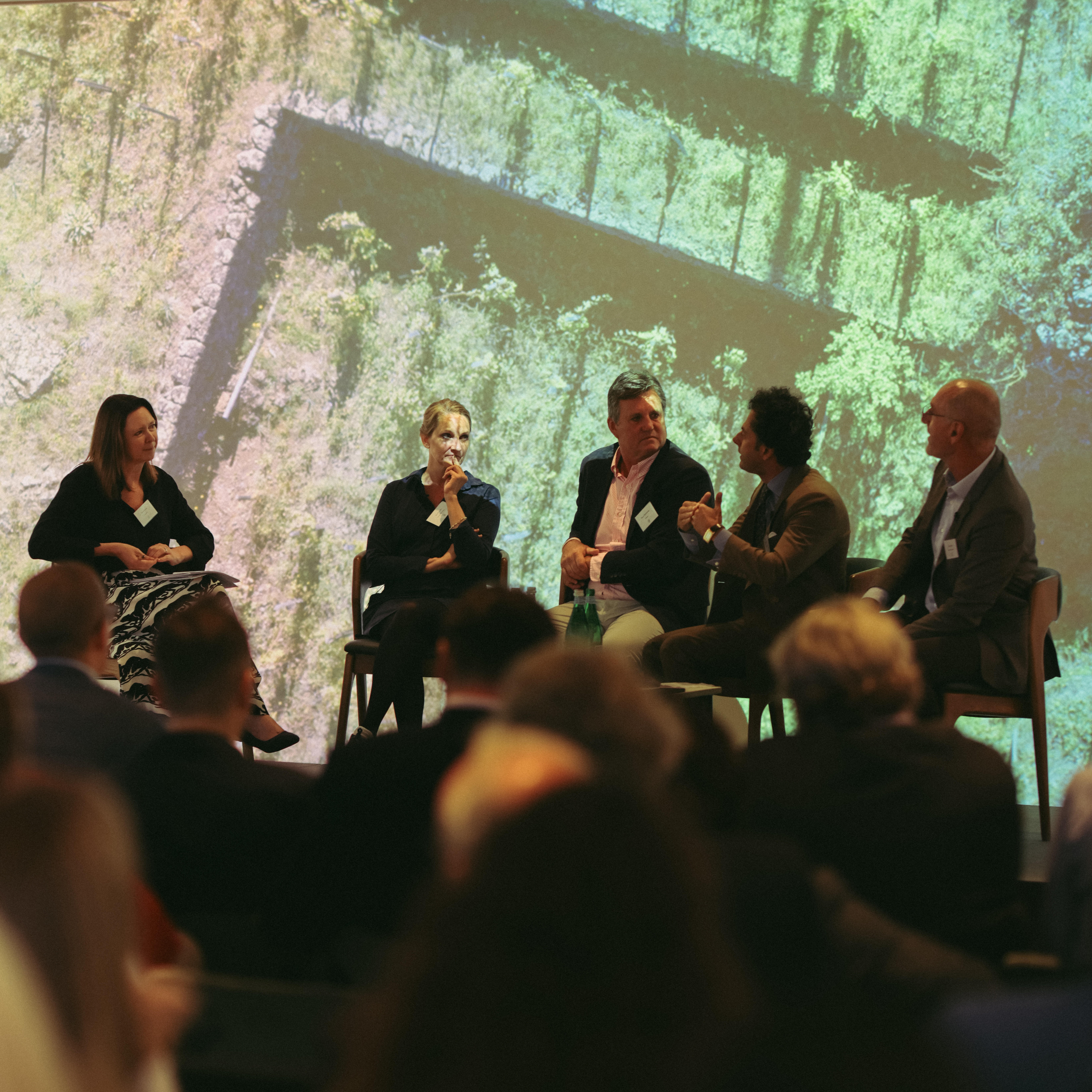 Host Jane Anson with our guests on stage at our inaugural Sustainability Forum in the BAFTA building. To Jane's right, the four guests are seated: Eva Fricke, Dean Hewitson, Alberto Graci (who is speaking) and Eric Kohler.