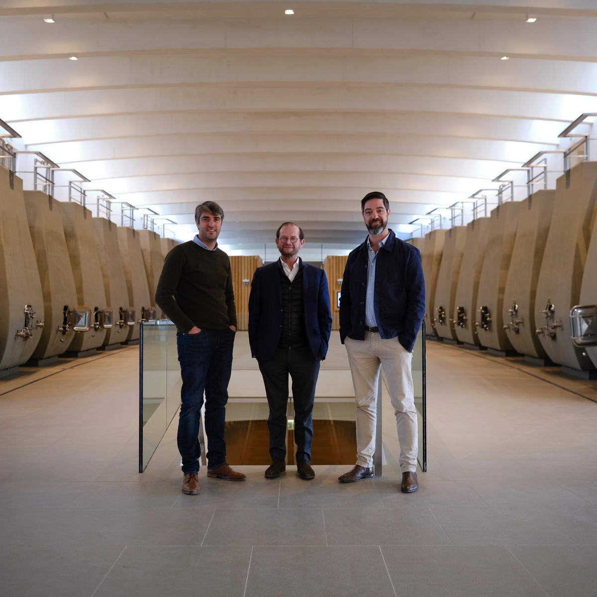 Pierre-Olivier Clouet, Pierre Lurton and Arnaud de Laforcade in the cellars of Cheval Blanc.