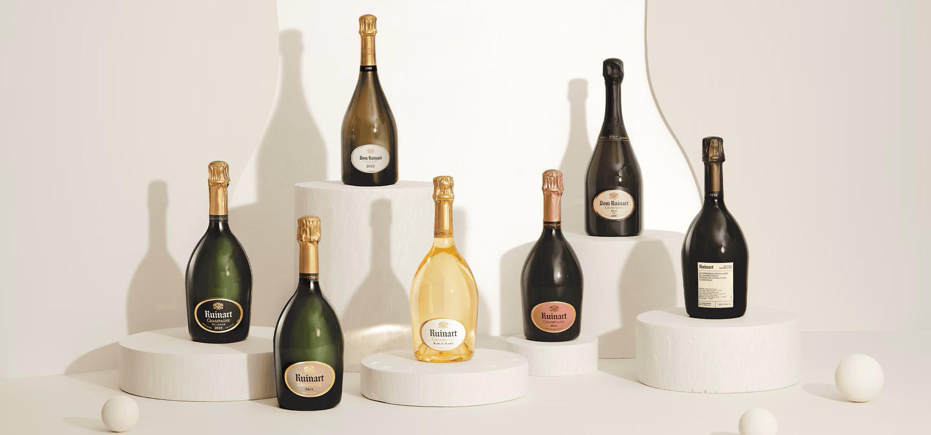 Bottles of Ruinart Champagne, including Blanc de Blancs and Rosé