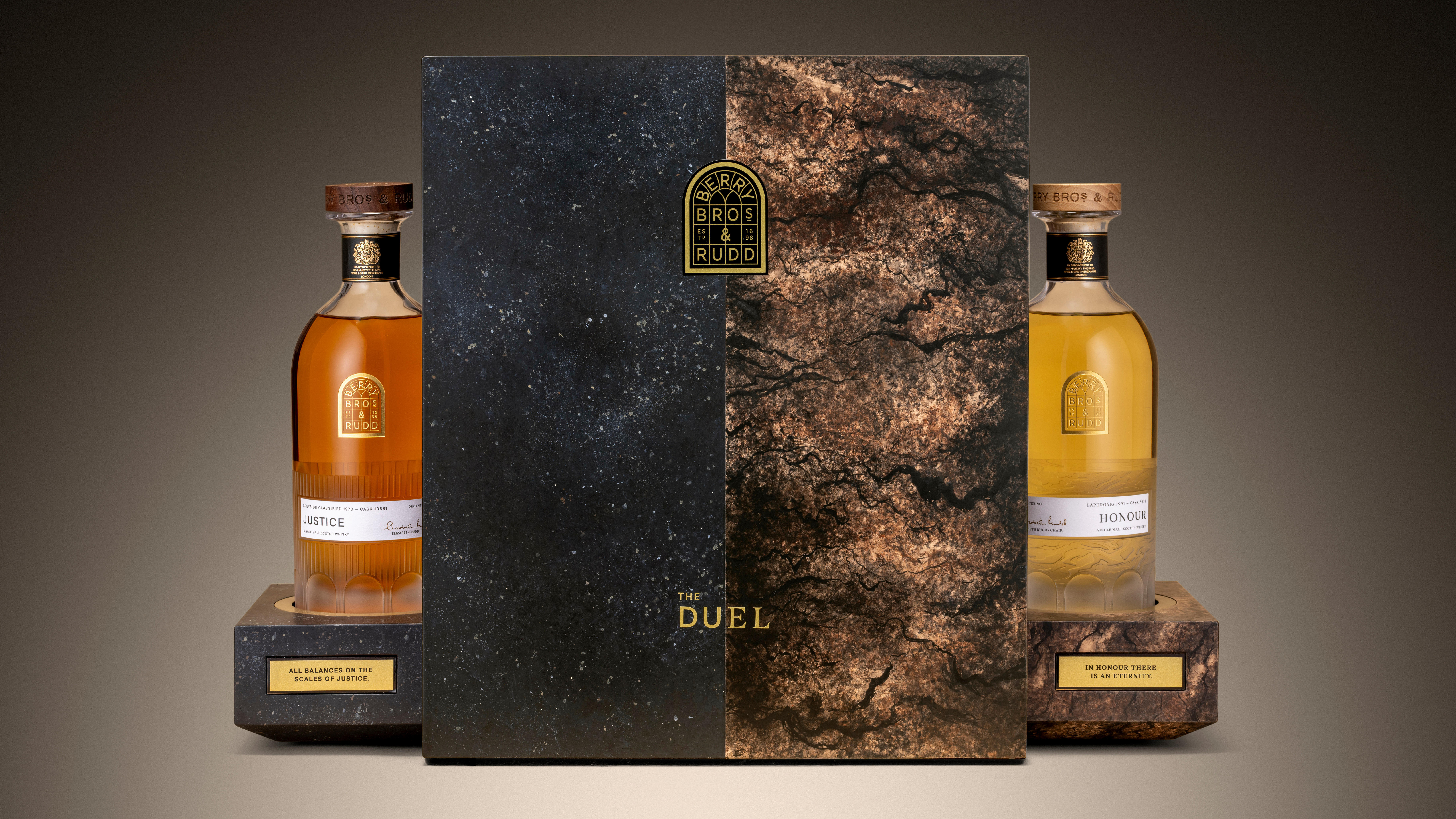 Four bottles of Bordeaux red wine from Pauillac, vintage 2005, displayed on a marble surface. Labels visible: Château Lafite Rothschild, Château Mouton Rothschild, Les Forts de Latour, and Château Pontet-Canet.